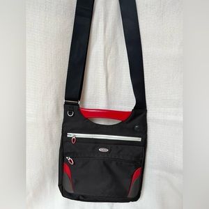 Tumi nylon crossbody bag. Black with red accents.